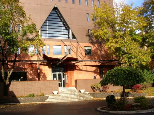 Exterior of Nahum Gelber Law Library in the sun